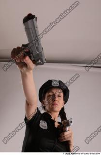 32 NIKITA POLICEWOMAN STANDING POSE WITH TWO GUNS